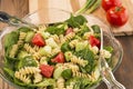 Bowl of spinach and rotini pasta salad