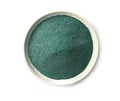 Bowl of spirulina algae powder isolated on white Royalty Free Stock Photo