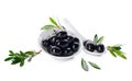 Bowl and spoon with black olives on white background Royalty Free Stock Photo