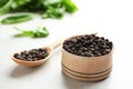 Bowl and spoon with black peppercorns Royalty Free Stock Photo