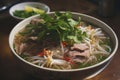 Bowl of steaming Asian-style beef noodle soup topped with fresh herbs, AI-generated. Royalty Free Stock Photo