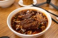 Bowl of steaming Chinese beef noodle soup with fresh noodles and savory broth, ready to be enjoyed Royalty Free Stock Photo