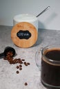 A bowl with stevia sweetener and a glass of black coffee, grey background Royalty Free Stock Photo