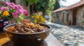 Bowl of stew on a table in a rustic village street Royalty Free Stock Photo