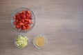 A bowl of strawberries, a lemon and brown sugar.