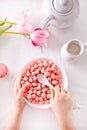 bowl with strawberry sweet corn balls. Delicious and healthy breakfast cereal. Kid hand take a spoon and eating Royalty Free Stock Photo