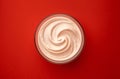Bowl of strawberry yogurt on red background, top view Royalty Free Stock Photo