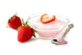 Bowl of strawberry yogurt with spoon and berries over white Royalty Free Stock Photo