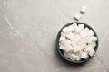 Bowl with sugar cubes on grey marble table, top view. Space for text Royalty Free Stock Photo