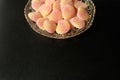 Bowl of sugared jelly sweets in crystal cut glass dish on minimal metallic black background Royalty Free Stock Photo