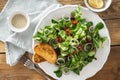 Bowl summer salad green mache leaves baked tomatoes Royalty Free Stock Photo