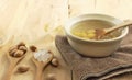 Bowl of swallow nest clear soup and ginkgo seeds Royalty Free Stock Photo