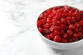 Bowl of sweet cherries on marble background, space for text. Dried fruit Royalty Free Stock Photo