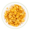 Bowl of sweet cornflakes with milk isolated on white background, top view Royalty Free Stock Photo