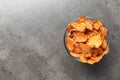 Bowl with sweet potato chips on grey table, top view Royalty Free Stock Photo