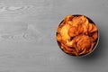 Bowl of sweet potato chips on grey table, top view Royalty Free Stock Photo