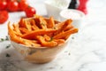 Bowl with sweet potato fries on marble table Royalty Free Stock Photo