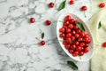 Bowl with sweet red cherries on marble table, Royalty Free Stock Photo