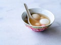 Bowl of tangyuan / tang yuan, a traditional Chinese desert of glutinous rice flour balls in a sweet soup eaten on the Dongzhi and Royalty Free Stock Photo