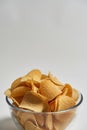 Bowl of tasty and appetizing heap of potato chips
