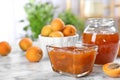 Bowl with tasty apricot jam Royalty Free Stock Photo