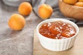 Bowl with tasty apricot jam Royalty Free Stock Photo
