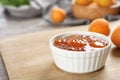 Bowl with tasty apricot jam Royalty Free Stock Photo