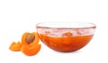 Bowl with tasty apricot jam and fruits Royalty Free Stock Photo