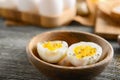 Bowl with tasty boiled eggs on wooden table Royalty Free Stock Photo