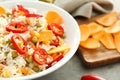 Bowl with tasty boiled rice and vegetables on grey table, closeup Royalty Free Stock Photo