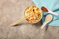 Bowl with tasty boiled rice and vegetables on table Royalty Free Stock Photo