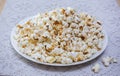 Bowl with tasty caramel popcorn on wooden background Royalty Free Stock Photo