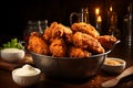 Bowl of tasty chicken fry on wooden table in dark background