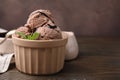 Bowl of tasty chocolate ice cream on wooden table, closeup. Space for text Royalty Free Stock Photo