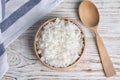 Bowl with tasty cooked rice on white wooden table Royalty Free Stock Photo