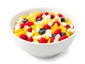 bowl of tasty cornflakes with berries on white background