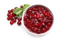 Bowl with tasty cranberry sauce on white background, top view