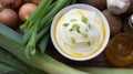 Bowl of tasty cream cheese with ingredients on a wooden table Royalty Free Stock Photo