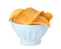 Bowl with tasty crispy potato chips on white background Royalty Free Stock Photo