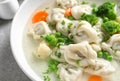 Bowl of tasty dumplings in broth on , closeup Royalty Free Stock Photo