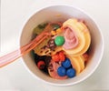 A bowl of tasty frozen yogurt with chocolate and fruits Royalty Free Stock Photo