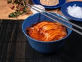 Bowl of tasty Kimchi - fermented Korean vegetables, and chopsticks