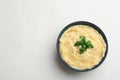 Bowl with tasty mashed potatoes and space for text on white background