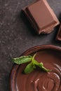 Bowl with tasty melted chocolate on table, closeup Royalty Free Stock Photo