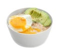 Bowl with tasty oatmeal, fried egg and sliced avocado on white background