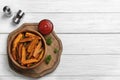 Bowl with tasty sweet potato fries on wooden background Royalty Free Stock Photo