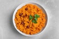 Bowl of tasty sweet potato puree on grey marble table Royalty Free Stock Photo