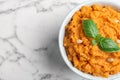 Bowl of tasty sweet potato puree on marble table. Space for text Royalty Free Stock Photo