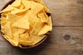 Bowl with tasty tortilla chips nachos on wooden table, top view. Space for text Royalty Free Stock Photo