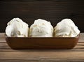 Bowl with tasty vanilla ice cream on table against light background. Created with Generative AI technology. Royalty Free Stock Photo